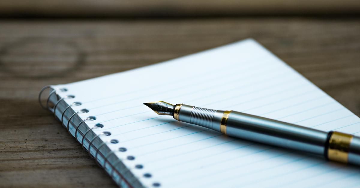 Photo of a pen and notepad